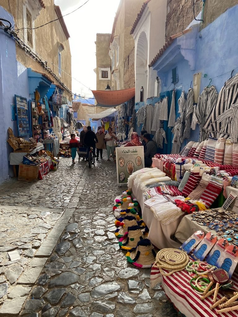 street filled with stalls of items to buy