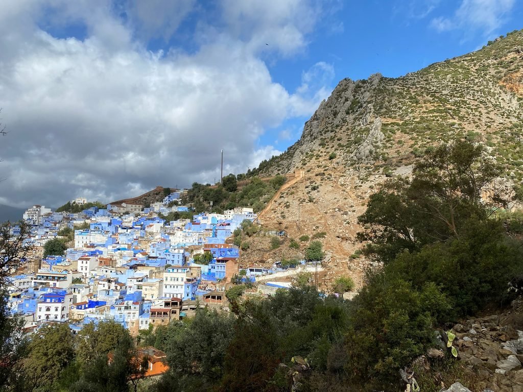 The Blue city emerging as you drive up into the Rif mountains