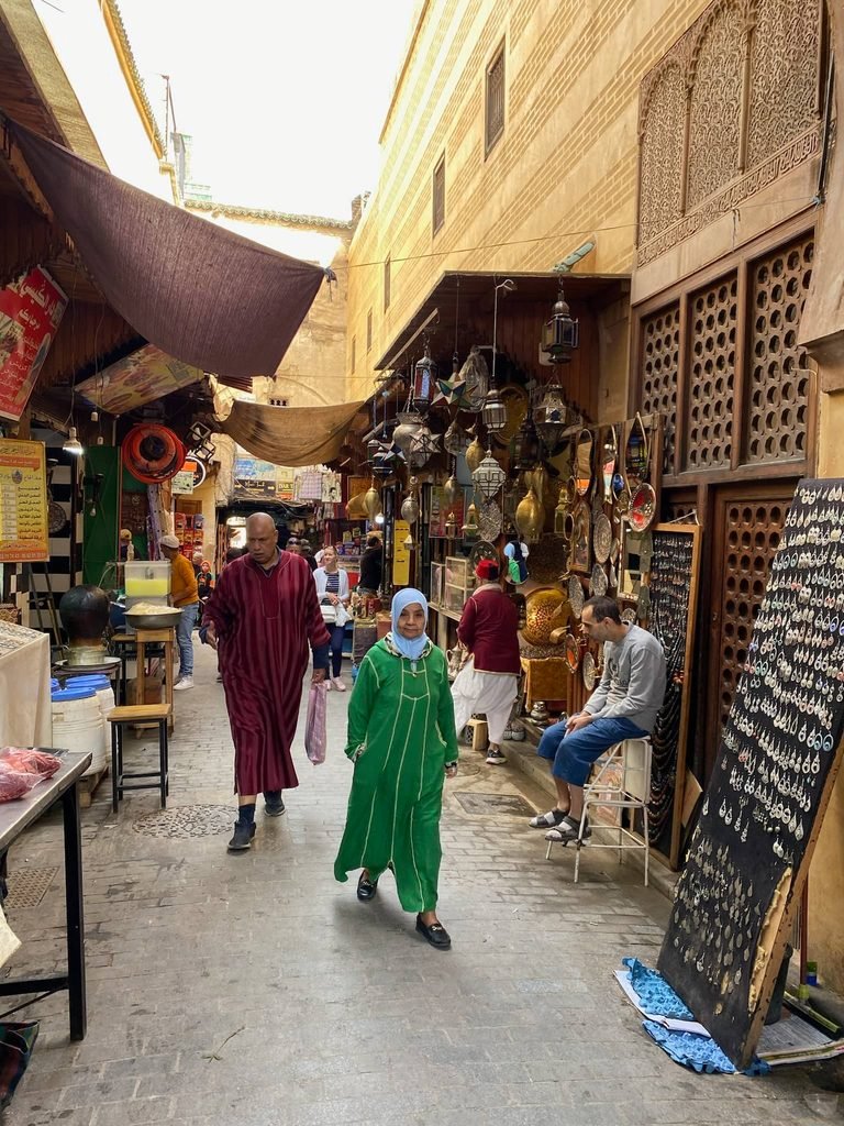 people walking in the medina streets