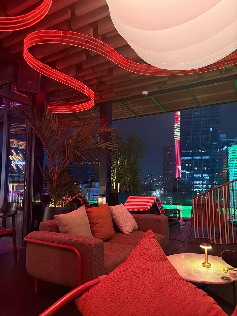 bar at night with skyline behind