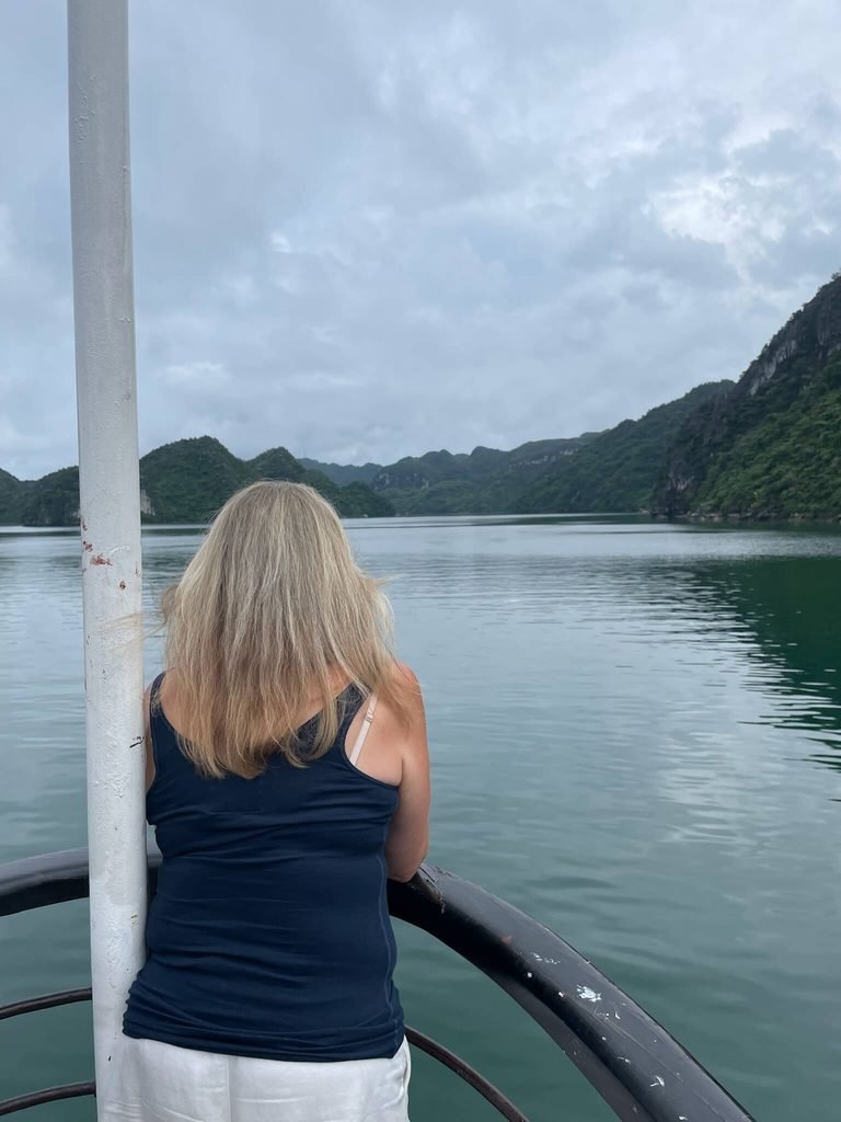woman looking out across the bay from the boat