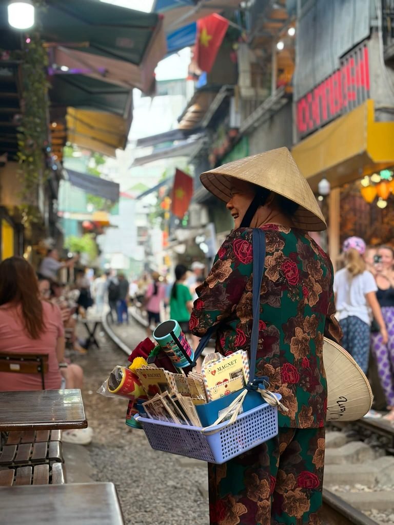 lady selling items on train street
