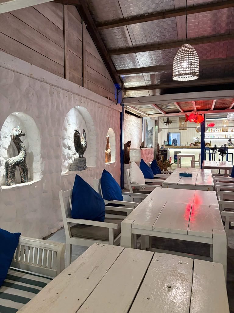 white tables and chairs in restaurant