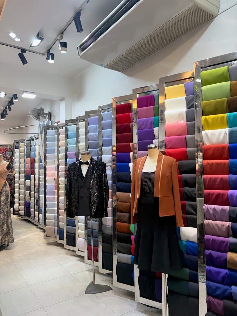 suit shop with fabrics and mannequins