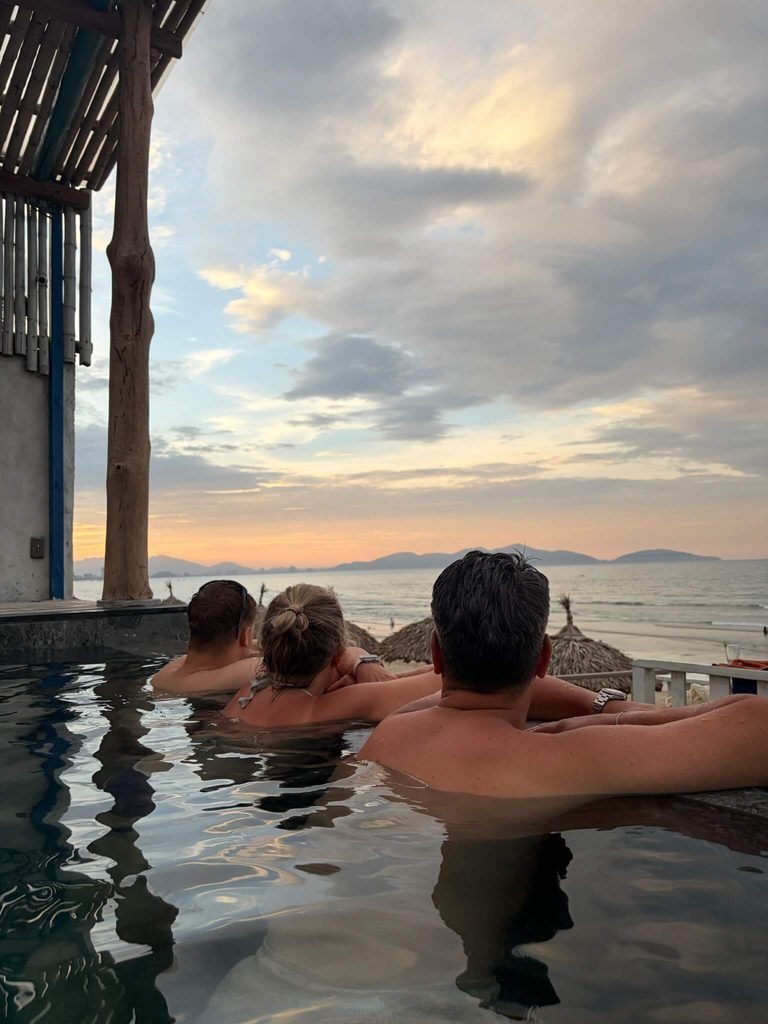 admiring view at sunset from pool