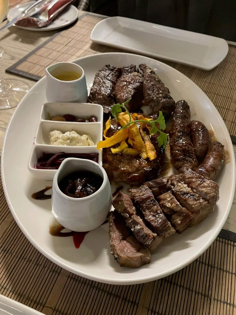 big plate of meats - steak, ostrich, kudu and warthog