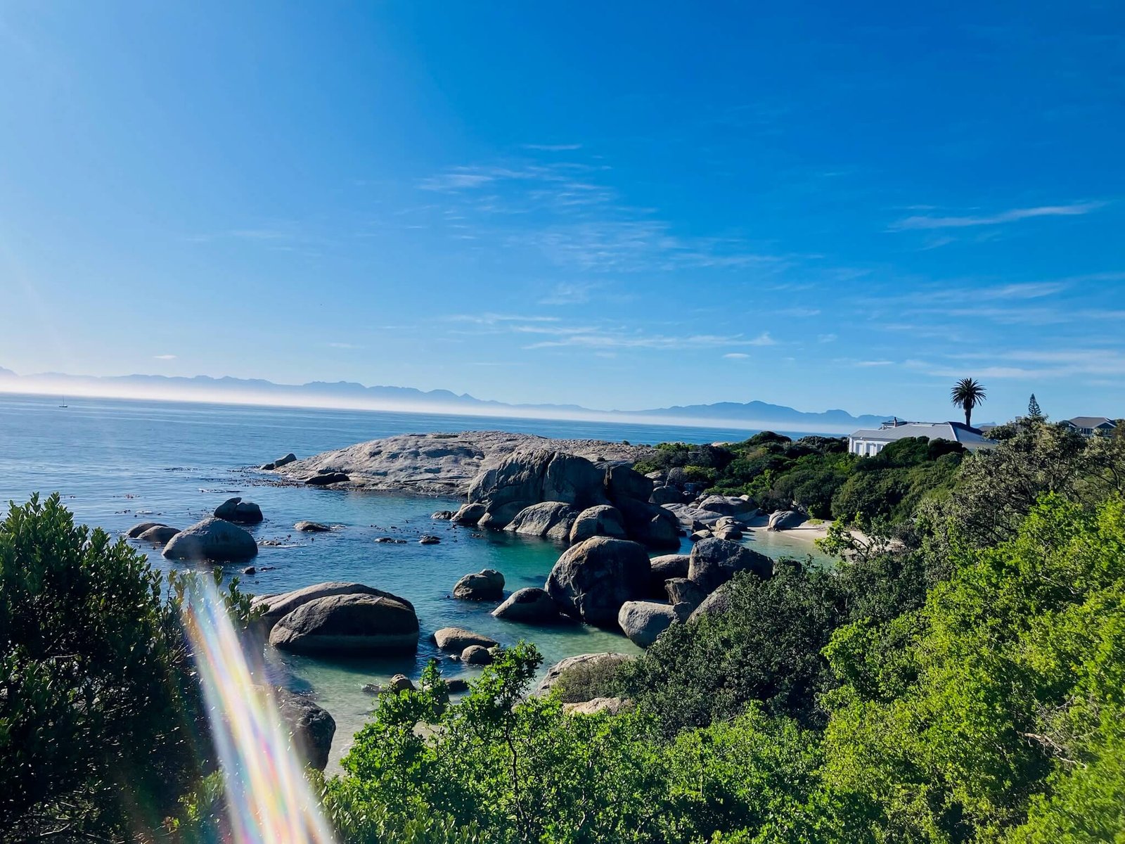 view across the sea at cape town peninsula on a bright sunny day